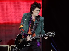 FILE - In this Saturday, Sept. 9, 2017 file photo, Ronnie Wood of the Rolling Stones performs during the first concert of their 'No Filter' Europe Tour 2017 in Hamburg, Germany. Rolling Stones guitarist Ronnie Wood might have a shot at winning the world's most grueling steeplechase for the first time with a not so wild horse. British Grand National organizers say Wood's horse, Sandymount Duke, is among 112 entries that will be whittled down to 40 runners for the race on April 6.