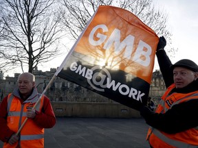 Historic Royal Palaces (HRP) employees protest over the closure of their pension scheme, at Tower Hill in London, Tuesday, Jan. 22, 2019. HRP have decided to close employees' final salary pensions despite promises made to them at the time of privatisation.