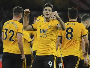 Wolverhampton's Raul Jimenez celebrates after he scores his sides first goal during the English FA Cup third round soccer match between Wolverhampton Wanderers and Liverpool at the Molineux Stadium in Wolverhampton, England, Monday, Jan. 7, 2019.