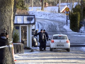Security staff are seen at the location where representatives of the United States, North Korea and South Korea are holding a secret meeting, in Stockhom, Sunday, Jan. 20, 2019. President Donald Trump said Saturday that "things are going very well with North Korea" and he plans a second summit with leader Kim Jong Un to try to broker a deal that would entice the North to give up its nuclear weapons.