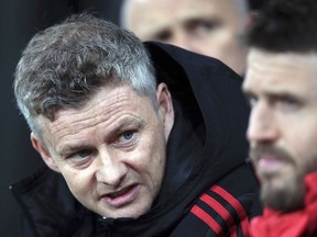 Manchester United interim manager Ole Gunnar Solskjaer, left, speaks with coach Michael Carrick during a Premier League soccer match against Newcastle United at St James' Park, Wednesday, Jan. 2, 2019, in Newcastle, England.