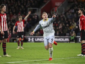 Derby County's Martyn Waghorn celebrates scoring his side's second goal of the game against Southampton, during their English FA Cup third round replay soccer match at St Mary's Stadium in Southampton, England, Wednesday Jan. 16, 2019.