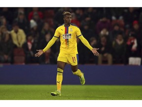 Crystal Palace's Wilfried Zaha celebrates scoring his side's first goal of the game against Southampton, during their English Premier League soccer match at St Mary's Stadium in Southampton, England, Wednesday Jan. 30, 2019.