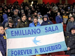 Cardiff City fans hold a banner in the stands, reading 'Emiliano Sala Forever a Bluebird',  ahead of the match against Arsenal, before the English Premier League soccer match at the Emirates Stadium in London, Tuesday Jan. 29, 2019.  Tonight should have been the debut match for Emiliano Sala, who is believed to have died in a plane crash Monday Jan. 21.