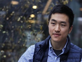 Harvard University graduate Jin K. Park, who holds a degree in molecular and cellular biology, listens during an interview in Cambridge, Mass., Thursday, Dec. 13, 2018. Park, who was named a Rhodes Scholar along with 30 other Americans in November, entered the U.S. illegally as a child, moving to Queens borough of New York City with his family. The undocumented student, who participates in the Deferred Action for Childhood Arrivals program (DACA), is not sure if he'll be allowed back in the U.S. after his studies in the United Kingdom.