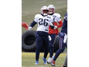 New England Patriots running back Sony Michel (26) warms up during an NFL football practice, Wednesday, Jan. 16, 2019, in Foxborough, Mass. The Patriots are scheduled to face the Kansas City Chiefs in the AFC championship game, Sunday, Jan. 20, in Kansas City.