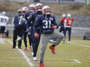 New England Patriots defensive back Jonathan Jones (31) warms up with teammates during an NFL football practice, Wednesday, Jan. 16, 2019, in Foxborough, Mass. The Patriots are scheduled to face the Kansas City Chiefs in the AFC championship game, Sunday, Jan. 20, in Kansas City.