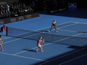 China's Zhang Shuai, left, and Australia's Samantha Stosur, second from left, play France's Kristina Mladenovic, second from right, and Hungary's Timea Babos in the women's doubles final at the Australian Open tennis championships in Melbourne, Australia, Friday, Jan. 25, 2019.