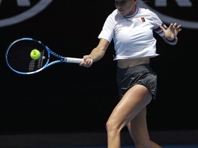 United States's Amanda Anisimova makes a forehand return to Petra Kvitova of the Czech Republic during their fourth round match at the Australian Open tennis championships in Melbourne, Australia, Sunday, Jan. 20, 2019.