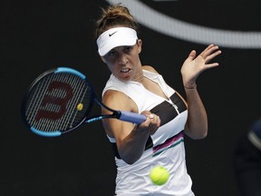 United States' Madison Keys hits a forehand return to Australia's Destanee Aiava during their first round match at the Australian Open tennis championships in Melbourne, Australia, Tuesday, Jan. 15, 2019.