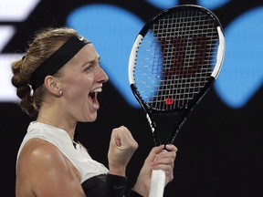 Petra Kvitova of the Czech Republic celebrates after defeating Australia's Ashleigh Barty in their quarterfinal match at the Australian Open tennis championships in Melbourne, Australia, Tuesday, Jan. 22, 2019.