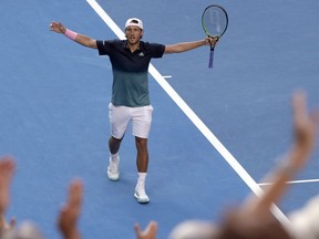 France's Lucas Pouille celebrates after defeating Canada's Milos Raonic in their quarterfinal match at the Australian Open tennis championships in Melbourne, Australia, Wednesday, Jan. 23, 2019.