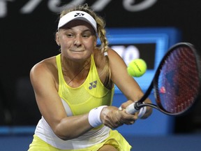 Ukraine's Dayana Yastremska makes a backhand return to Spain's Carla Suarez Navarro during their second round match at the Australian Open tennis championships in Melbourne, Australia, Thursday, Jan. 17, 2019.