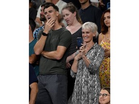 Jamie and Judy Murray watch a presentation for Britain's Andy Murray following his first round loss to Spain's Roberto Bautista Agut at the Australian Open tennis championships in Melbourne, Australia, Monday, Jan. 14, 2019.