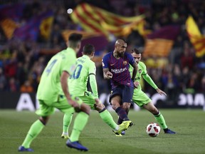 FC Barcelona's Arturo Vidal, second right, kicks the ball during a Spanish Copa del Rey soccer match between FC Barcelona and Levante at the Camp Nou stadium in Barcelona, Spain, Thursday, Jan. 17, 2019.