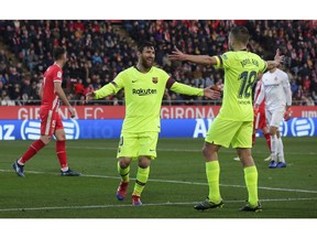 FC Barcelona's Lionel Messi celebrates after scoring his side's second goal during the Spanish La Liga soccer match between Girona and FC Barcelona at the Montilivi stadium in Girona, Spain, Sunday, Jan. 27, 2019.