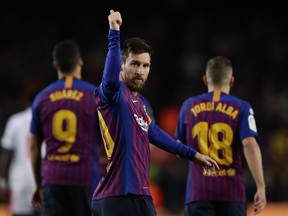 FC Barcelona's Lionel Messi, centre, celebrates after scoring his side's second goal during the Spanish La Liga soccer match between FC Barcelona and Eibar at the Camp Nou stadium in Barcelona, Spain, Sunday, Jan. 13, 2019.