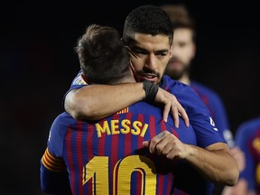 FC Barcelona's Lionel Messi celebrates after scoring his side's second goal with his teammate Luis Suarez during the Spanish La Liga soccer match between FC Barcelona and Eibar at the Camp Nou stadium in Barcelona, Spain, Sunday, Jan. 13, 2019.