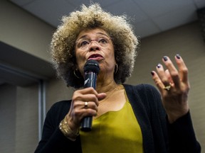 In this Feb. 19, 2015, file photo Angela Davis, author, educator and iconic civil rights activist, speaks during her visit to the University of Michigan-Flint, in Flint, Mich.