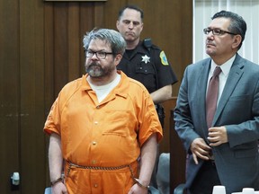 FILE - In this April 20, 2017 file photo, defendant Jason Dalton, left, who is charged with killing six people in-between picking up riders for Uber, stands with attorney Eusebio Solis during a hearing in Kalamazoo, Mich. Jury selection will begin on Jan. 3, 2019 after a prosecutor said he won't appeal a decision that keeps a lid on parts of a police interview. Kalamazoo County prosecutor Jeff Getting says it's time to bring the "matter to trial without further delay." The shootings occurred more than two years ago.