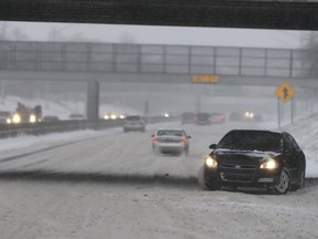 A vehicle spins out on Interstate 94 in Detroit, Saturday, Jan. 19, 2019. The massive storm dumped 10 inches of snow on some areas of the Midwest. Following the storm system, some areas were expecting high winds and bitter cold, and in Iowa, temperatures in the teens Saturday were expected to drop below zero overnight, producing wind chills as low as 20-below by Sunday morning.