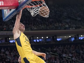 Indiana Pacers forward Bojan Bogdanovic dunks during the first half of the team's NBA basketball game against the New York Knicks, Friday, Jan. 11, 2019, at Madison Square Garden in New York.