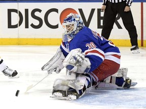 New York Rangers goaltender Henrik Lundqvist deflects the puck during the first period of an NHL hockey game against the Pittsburgh Penguins Wednesday, Jan. 2, 2019, at Madison Square Garden in New York.