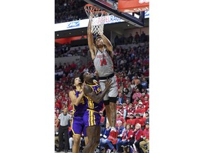 Mississippi forward KJ Buffen (14) shoots over LSU forward Emmitt Williams (24) and guard Skylar Mays (4) during the first half of an NCAA college basketball game in Oxford, Miss., Tuesday, Jan. 15, 2019.