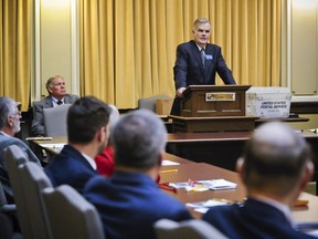 FILE - In this Nov. 14, 2018 file photo Senate President Scott Sales, R-Bozeman, addresses the Senate Republican caucus at the State Capitol in Helena, Mont. Montana's Senate president is proposing the state give more than $8 million to help build President Donald Trump's proposed wall on the Mexican border. Sales, a Republican, says his proposal is a "small token" to show border security "is of vital interest to all citizens regardless of what state they live in."