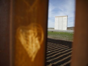 A prototype of border wall sits behind the bars of the current border wall, where the shape of a heart has been etched, Tuesday, Jan. 8, 2019, seen from Tijuana, Mexico. Ready to make his case on prime-time TV, President Donald Trump is stressing humanitarian as well as security concerns at the U.S.-Mexico border as he tries to convince America he must get funding for his long-promised border wall before ending a partial government shutdown that has hundreds of thousands of federal workers facing missed paychecks.