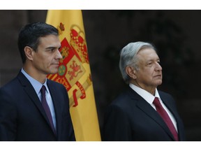 Spain's Prime Minister Pedro Sanchez, left, attends his welcome ceremony alongside Mexican President Andres Manuel Lopez Obrador at the National Palace in Mexico City, Wednesday, Jan. 30, 2019. Sanchez is on an official visit to Mexico.