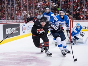 Canada's Maxime Comtois battles Finland's Oskari Laaksonen during the first period of IIHF world junior hockey championship action in Vancouver on Jan. 2, 2019. Canada lost to Finland 2-1 in overtime.