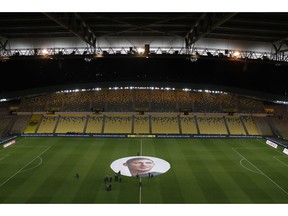 A giant canvas showing Argentinian player Emiliano Sala is pictured in La Beaujoire stadium before the French soccer League One match Nantes against Saint-Etienne, in Nantes, western France, Wednesday, Jan.30, 2019. Sala disappeared over the English Channel on Jan. 21, 2019 as it flew from France to Wales. Sala had just been signed by Premier League club Cardiff.