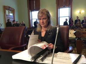 New Brunswick Auditor General Kim MacPherson prepares to present her report to a committee of the legislature in Fredericton, Wednesday, Jan.16, 2019.