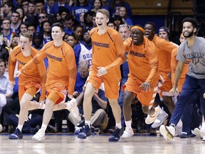 Syracuse players celebrate as time expires during overtime in an NCAA college basketball game against Duke in Durham, N.C., Monday, Jan. 14, 2019. Syracuse won 95-91.