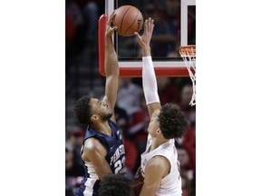 Nebraska's Isaiah Roby, right, blocks a shot by Penn State's Josh Reaves (23) during the first half of an NCAA college basketball game in Lincoln, Neb., Thursday, Jan. 10, 2019.