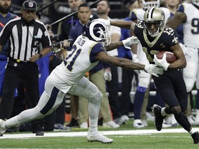New Orleans Saints' Michael Thomas tries to get away from Los Angeles Rams' Aqib Talib during the first half the NFL football NFC championship game Sunday, Jan. 20, 2019, in New Orleans.