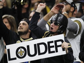 Fans cheer during the first half the NFL football NFC championship game between the New Orleans Saints and the Los Angeles Rams, Sunday, Jan. 20, 2019, in New Orleans.