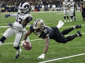 Los Angeles Rams' Nickell Robey-Coleman breaks up a pass intended for New Orleans Saints' Tommylee Lewis during the second half of the NFL football NFC championship game Sunday, Jan. 20, 2019, in New Orleans.