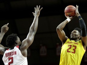 Maryland forward Bruno Fernando (23) shoots over Rutgers center Shaquille Doorson (2) during the first half of an NCAA college basketball game, Saturday, Jan. 5, 2019, in Piscataway, N.J.