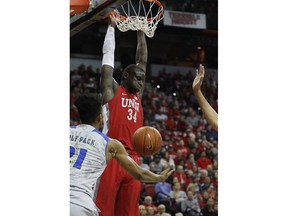 UNLV's Cheikh Mbacke Diong dunks against Nevada during the first half of an NCAA college basketball game Tuesday, Jan. 29, 2019, in Las Vegas.