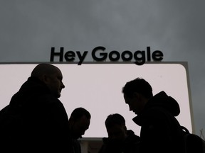 People stand in front of the Google tent during preparations for CES International, Saturday, Jan. 5, 2019, in Las Vegas.