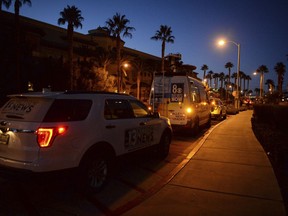 Local news station vans line up after reports of a shooting at Green Valley Ranch casino in Henderson, Nev., Tuesday, Jan. 1, 2019.