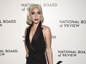 FILE - In this Jan. 8, 2019 file photo, Lady Gaga attends the National Board of Review Awards gala at Cipriani 42nd Street in New York. Lady Gaga is sorry for her 2013 duet with singer R. Kelly in the wake of sexual misconduct allegations against the rapper and she intends to remove the song from streaming services. Posting on Twitter Wednesday, Jan. 9Gaga wrote she had collaborated with Kelly on "Do What U Want (With My Body)" during a "dark time" in her life as a victim of sexual assault. She said she should have sought therapy or other help instead.
