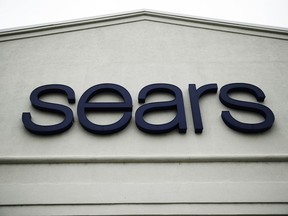 FILE - This Oct. 15, 2018 file photo shows a sign for a Sears Outlet department store is displayed in Norristown, Pa.  Multiple media outlets reported early Wednesday, Jan. 16, 2019, that billionaire Eddie Lampert has won a bankruptcy auction after strengthening his bid in several days of negotiations with creditors. Lampert, Sears' chairman and largest shareholder, upped his offer to more than $5 billion and added a $120 million cash deposit through an affiliate of his ESL hedge fund.