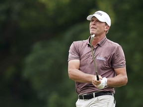 FILE - In this July 15, 2018, file photo, Steve Stricker hits on the ninth fairway during the final round of the John Deere Classic golf tournament, in Silvis, Ill.  Stricker, who is about to turn 52, is not ready for a fulltime schedule on the PGA Tour Champions.