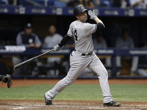 FILE - In this Sept. 26, 2018, file photo, New York Yankees' Neil Walker bats during the team's baseball game against the Tampa Bay Rays in St. Petersburg, Fla. Walker has agreed to a one-year contract with the Miami Marlins and is expected to compete for a starting job.