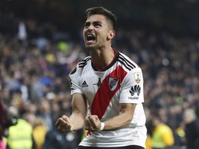 FILE - In this Dec. 9, 2018, file photo, Gonzalo "Pity" Martinez of Argentina's River Plate celebrates after beating Argentina's Boca Juniors in the Copa Libertadores final soccer match in Madrid, Spain. Martinez has been acquired by Atlanta United, bolstering a team that won the MLS Cup championship in just its second season. United announced the long-anticipated transfer on Thursday, Jan. 24, 2019.