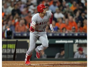 FILE - In this Sept. 21, 2018, file photo, Los Angeles Angels' Shohei Ohtani lines out against the Houston Astros during the fourth inning of a baseball game in Houston. Ohtani has been medically cleared to resume full strength training on his right arm following Tommy John surgery, although he will not be ready to hit for the Angels by opening day. Angels general manager Billy Eppler provided a positive update Thursday, Jan. 31, on the recovery of his two-way star.