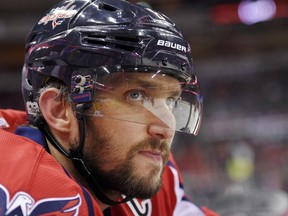 FILE - In this Tuesday, March 14, 2017, file photo, Washington Capitals left wing Alex Ovechkin, of Russia, looks on from the bench during the first period of an NHL hockey game against the Minnesota Wild in Washington. Ovechkin has decided to skip the All-Star Weekend in San Jose to get some extra rest and will serve an automatic one-game suspension. The Capitals announced Ovechkin's decision Wednesday, Jan. 2, 2019.